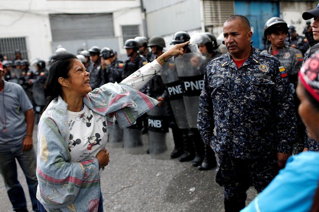 A woman points at a police officer outside the National Police Jail during a prisoners' riot in Caracas, Venezuela on September 4, 2019. (Photo by Manaure Quintero/Reuters)