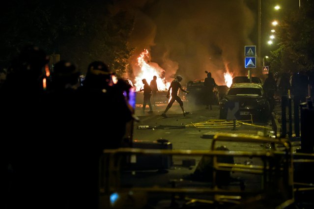 Protesters clash with French riot police in Nanterre, near Paris, France, 29 June 2023. Violence broke out after police fatally shot a 17-year-old during a traffic stop in Nanterre on 27 June 2023. According to the French interior minister, 31 people were arrested with 2,000 officers being deployed to prevent further violence. (Photo by Yoan Valat/EPA/EFE/Rex Features/Shutterstock)