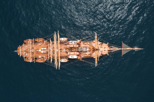 A handout photo made available by Italian Navy Press Office shows an aerial view of the Italian ship Amerigo Vespucci leaving from Genoa on world tour, Genoa, Italy on July 1, 2023. Italian naval academy flagship sailboat Amerigo Vespucci, one of the world's most iconic “tall ships”, is to take Italian products in 'Made in Italy' global tour for 20 months visiting 28 countries and 31 ports. (Photo by Italian Navy Press Office/EPA/EFE)