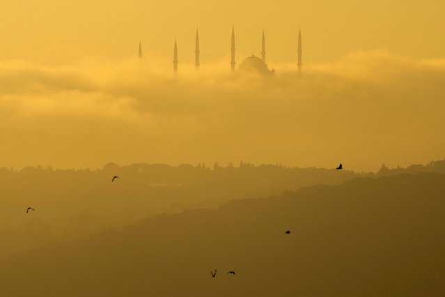 Morning fog engulfs Camlica mosque as the sun rises in Istanbul, Turkey, Tuesday, July 2, 2024. (Photo by Francisco Seco/AP Photo)