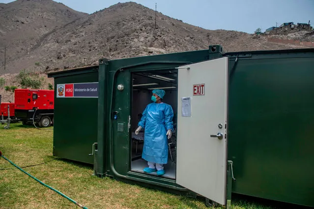 A specialist stands in a mobile unit set up by the Peruvian Ministry of Health as a preventive measure if a case of the COVID-19 virus comes up, at the Hipolito Unanue Hospital, in Lima on February 27, 2020. Peru have no record so far on cases of the COVID-19 virus. (Photo by Ernesto Benavides/AFP Photo)