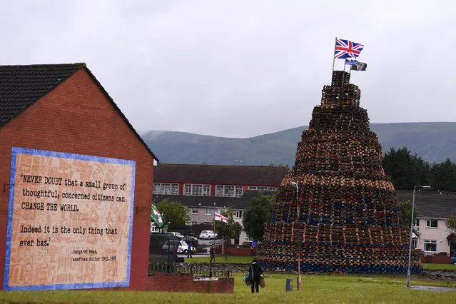A bonfire is seen in Hopewell Crescent, which will be set alight at midnight on Monday, ahead of the Twelfth of July celebrations held by members of the Orange Order in Belfast, Northern Ireland, July 10, 2016. (Photo by Clodagh Kilcoyne/Reuters)