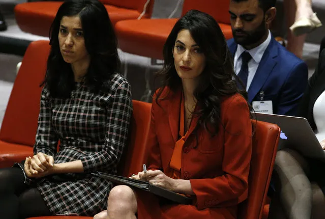 Activist Amal Clooney (R) attends a United Nations Security Council meeting set to adopt a resolution to help preserve evidence of Islamic State crimes in Iraq, during the 72nd United Nations General Assembly at U.N. Headquarters in New York, U.S., September 21, 2017. (Photo by Brendan Mcdermid/Reuters)