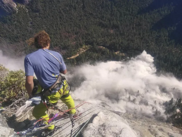 In this photo provided by Peter Zabrok, climber Ryan Sheridan who had just reached the top of El Capitan, a 7,569-foot (2,307 meter) formation, when a rock slide let loose below him Thursday, September 28, 2017, in Yosemite National Park, Calif. It was not immediately clear if there were new casualties, a day after another slab dropped from El Capitan, killing a British climber and injuring a second. (Photo by Peter Zabrok via AP Photo)