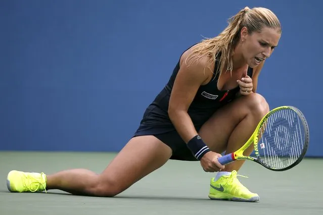Dominika Cibulkova of Slovakia hits the court with her racket after losing a point to Eugenie Bouchard of Canada during their women's singles third round match at the U.S. Open Championships tennis tournament in New York, September 4, 2015. (Photo by Mike Segar/Reuters)