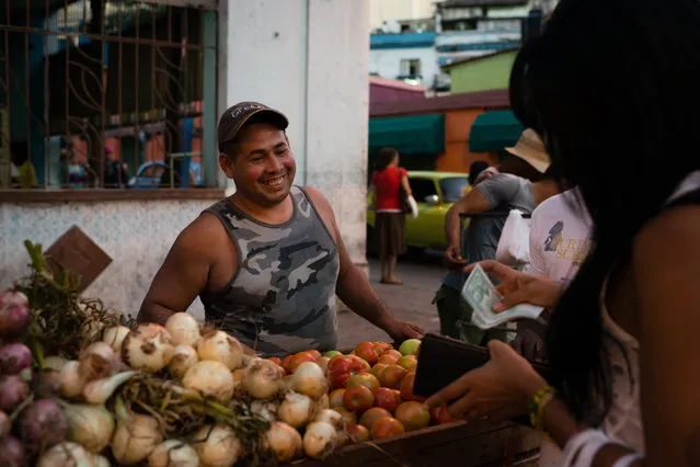Diosbel Arias Destradi sells produce in the Old Havana Neighborhood. He picks them up each morning at 5am in a market in the outskirts of the city. (Photo by Sarah L. Voisin/The Washington Post)