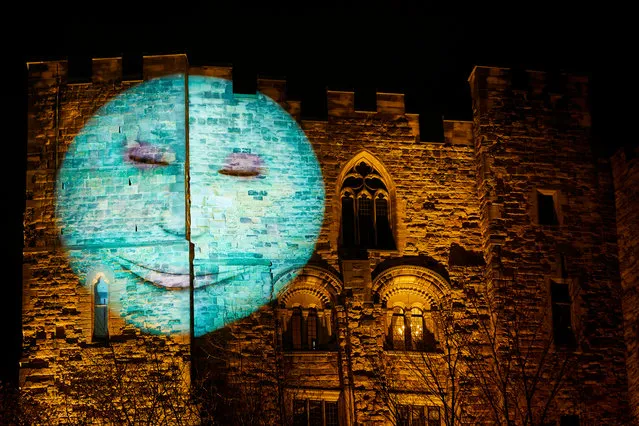 A light art installation entitled “Our Moon” by artist Hannah Fox is projected onto the walls of Durham Castle and features as part of Lumiere Durham light festival in Durham, northern England on November 15, 2017. The biennial Lumiere Durham festival brings together international light artists to create installations all across Durham city centre. (Photo by Christopher Thomond/The Guardian)