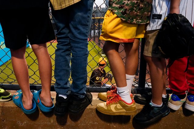 Young fans watch San Diego Padres pitcher Braden Nett throw in the bullpen before a spring training baseball game in Peoria, Arizona, on Friday, February 28, 2025. (Photo by Lindsey Wasson/AP Photo)