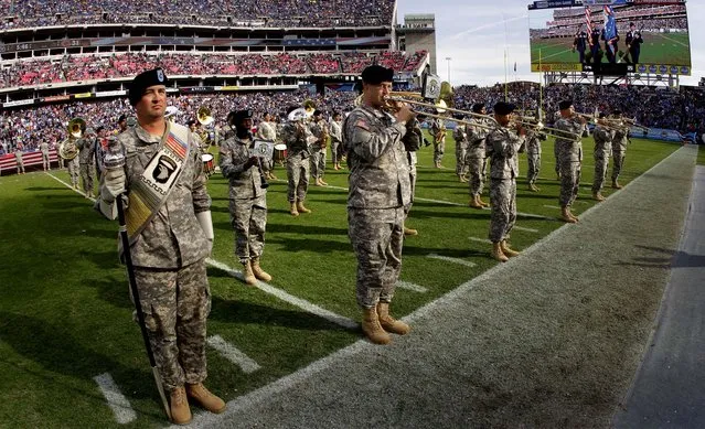 A band from Fort Campbell, Kentucky performs at halftime of the Titans – Bears game. Photo by (Wade Payne/Associated Press)