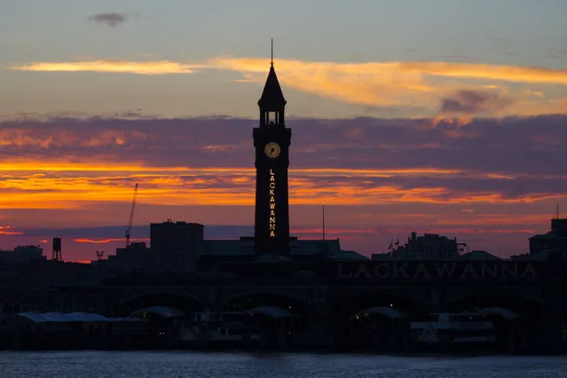 Sunset over the Hudson: the Hoboken Terminal and the Erie-Lackawanna Clock Tower. (Photo by Gordon Donovan/Yahoo News)