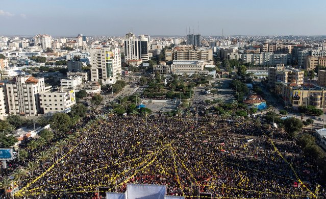 Palestinians take part in a rally to mark the 18th anniversary of the death of their leader Yasser Arafat, in Gaza City on November 10, 2022. Arafat, president of the Palestinian National Authority from 1994 to 2004, died on November 11, 2004 at the age of 75, after a period of illness. (Photo by Mahmud Hams/AFP Photo)