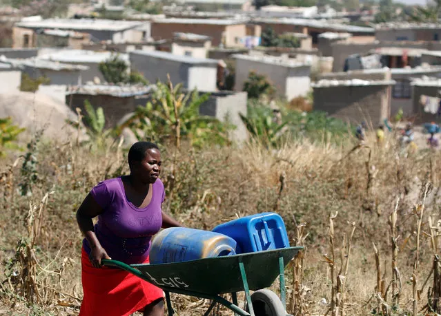 A woman fetches drinking water from a communal tap in Harare, Zimbabwe, August 31, 2016. (Photo by Philimon Bulawayo/Reuters)