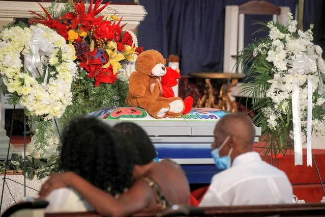Family members grieve prior to a funeral service for 1-year-old Davell Gardner, who was shot and killed while sitting in his stroller during a family barbeque in the Bedford-Stuyvesant neighborhood of Brooklyn, at the Pleasant Grove Baptist church in Brooklyn, New York, U.S., July 27, 2020. (Photo by Brendan McDermid/Reuters)