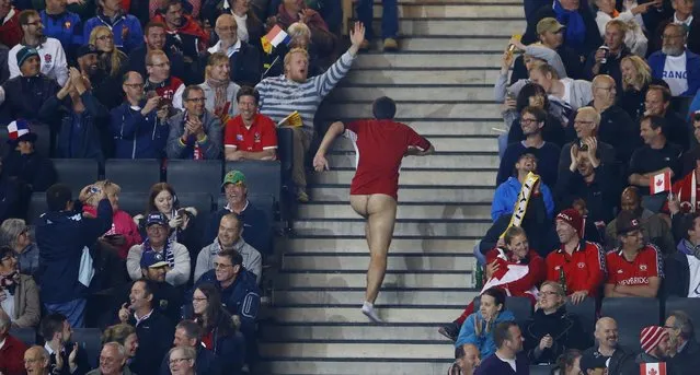 Rugby Union, France vs Canada, IRB Rugby World Cup 2015 Pool D, Stadium MK, Milton Keynes, England on October 1, 2015: A streaker runs up the stairs during the match. (Photo by Darren Staples/Reuters)