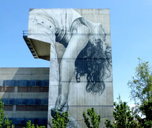 Guido van Helten, Windsor. This portrait of deaf contemporary dancer Ana Seymour was painted by Guido van Helten on a seven-storey building at Melbourne Polytechnic in January 2017. She is lost in the dance. Van Helten, who is based in Brisbane but spends much of his time travelling and painting, creates site-specific murals that connect with the human stories of the area. This mural reflects the polytechnic’s links to the deaf community via its Auslan diploma course and the presence of the organisation deafConnectED. (Photo by Lou Chamberlin/The Guardian)