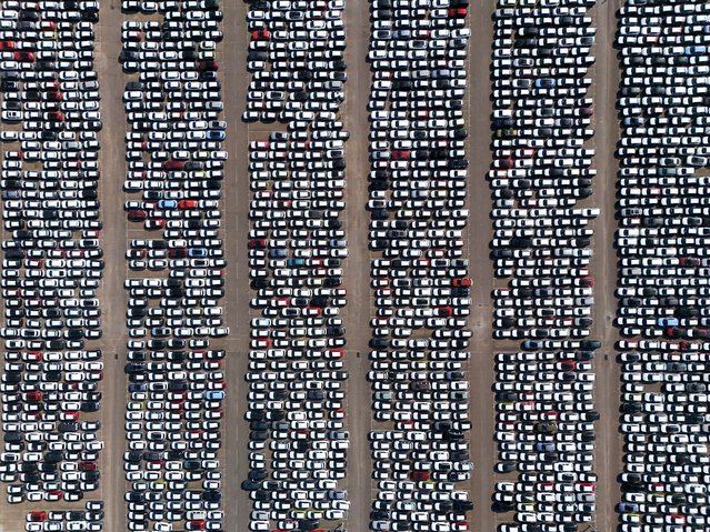 An image taken by a drone shows new cars parked at Tilbury Docks in Tilbury, Britain 27 March 2025. U.S. President Donald Trump announced new import taxes of 25 percent on cars and car parts coming into the U.S. The tariffs will take effect on 02 April, and charges on businesses importing vehicles will begin the following day. The U.S. is the second-largest importer of UK cars. Britain's Chancellor of the Exchequer, Rachel Reeves, has stated that the UK is working with Washington to secure an exemption from U.S. auto tariffs. (Photo by Neil Hall/EPA)