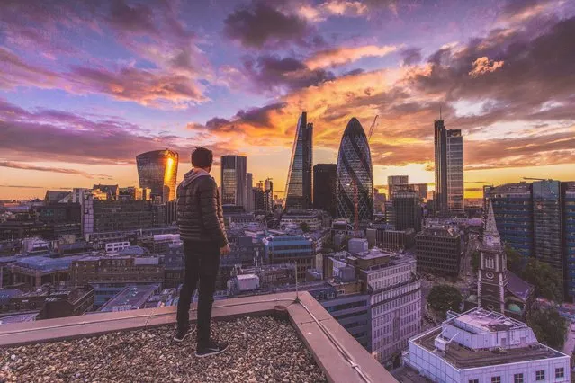 Jacob looking out to the London skyline. (Photo by Jacob Riglin/Caters News)