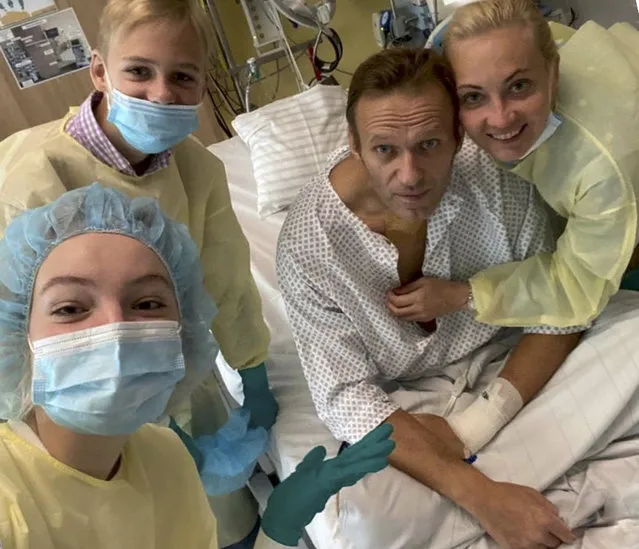 This handout photo published by Russian opposition leader Alexei Navalny on his instagram account, shows himself, centre, and his wife Yulia, right, posing for a photo with medical workers in a hospital hospital in Berlin, Germany. Russian opposition leader Alexei Navalny has posted the picture of himself in a hospital in Germany and says he's breathing on his own. He posted on Instagram Tuesday September 15, 2020: “Hi, this is Navalny. I have been missing you. I still can't do much, but yesterday I managed to breathe on my own for the entire day”. (Photo by Navalny instagram via AP Photo)