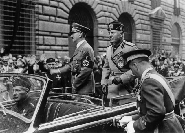 German dictator Adolf Hitler (1889 - 1945) and Italian dictator Benito Mussolini (1883 - 1945) drive through Rome, 9th May 1938. (Photo by Keystone/Getty Images)
