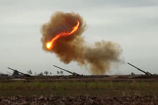An image grab taken from a video made available on the official web site of the Azerbaijani Defence Ministry on September 28, 2020, allegedly shows Azeri artillery strike towards the positions of Armenian separatists in the breakaway region of Nagorno-Karabakh. (Photo by Handout/Azerbaijani Defence Ministry/AFP Photo)