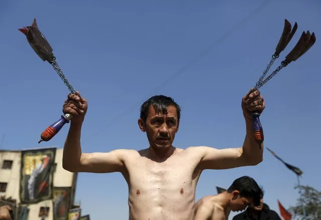 Afghan Shi'ite Muslims flagellate themselves with chains during an Ashura procession in Kabul, Afghanistan October 21, 2015. (Photo by Omar Sobhani/Reuters)