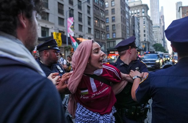 New York police detains some protesters as demonstrators rally outside the New York Times, accusing the paper of being complicit in providing coverage for the Israel's attacks on Gaza and protesting the killing of journalists in Gaza by Israeli forces in New York, USA, on August 12, 2025. (Photo by Selcuk Acar/Anadolu via Getty Images)