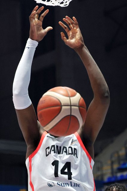 Charles Bediako, a Canadian basketball player, scores in a world cup quarter final game against Colombia at Polideportivo Alexis Arguello in Managua, Nicaragua on August 28, 2025. (Photo by Luisa Gonzalez/Reuters)