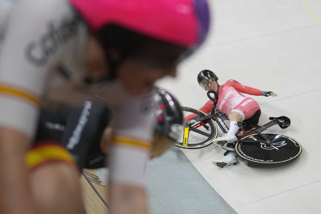 Hong Kong's Yang Qianyu crashes during the women's madison final at UCI Track Nations Cup track cycling championship at the Jakarta International Velodrome in Jakarta, Indonesia, Saturday, February 25, 2023. (Photo by Dita Alangkara/AP Photo)