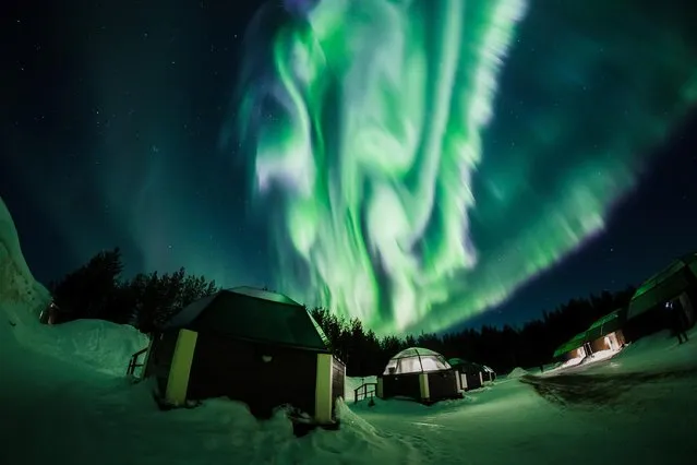 The Aurora Borealis (Northern Lights) is seen in the sky over Arctic Snowhotel in Rovaniemi, Finland on February 28, 2019. (Photo by Alexander Kuznetsov/Reuters)
