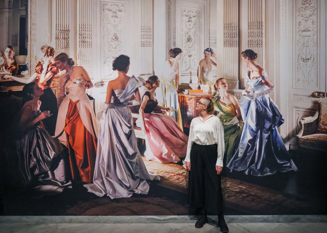 Gallery staff with Cecil Beaton, Worldly Colour (Charles James evening dresses), 1948 in London on October 8, 2025. Cecil Beaton's Fashionable World opens on 9th October at the National Portrait Gallery and runs until 11th January 2026. (Photo by Imageplotter/Alamy Live News)