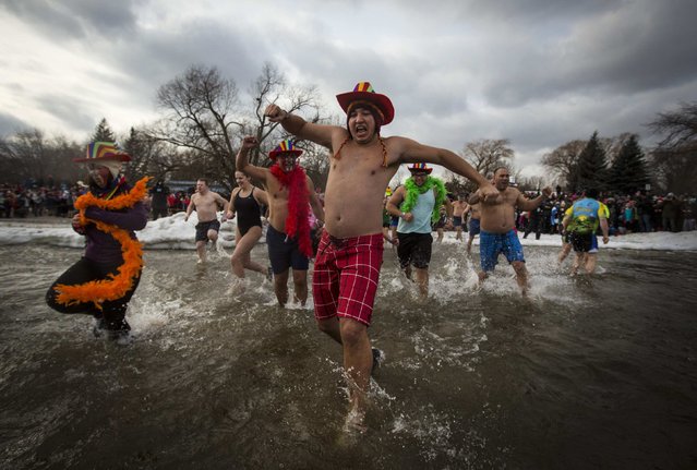 Participants take part in Courage Polar Bear Dip at Coronation Park in Oakville, January 1, 2015. (Photo by Mark Blinch/Reuters)