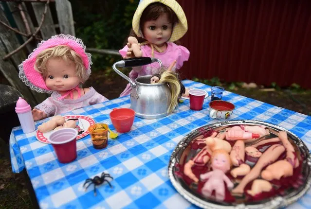 An open house known as “The Doll Asylum” in Portland, Oregon on October 23, 2016. Mark Williams and his wife Heidi Loutzenhiser love halloween so much they fill their home with over 1,000 creepy dolls before opening it up for the public to enjoy over the halloween season. (Photo by ddp USA/Rex Features/Shutterstock)