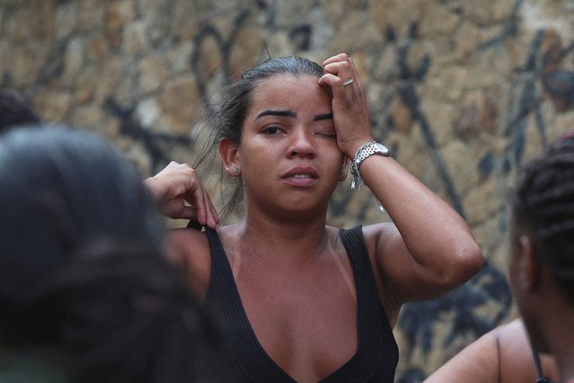 A woman reacts on the day of a police operation against drug trafficking at the favela do Penha, in Rio de Janeiro, Brazil, on October 28, 2025. (Photo by Aline Massuca/Reuters)