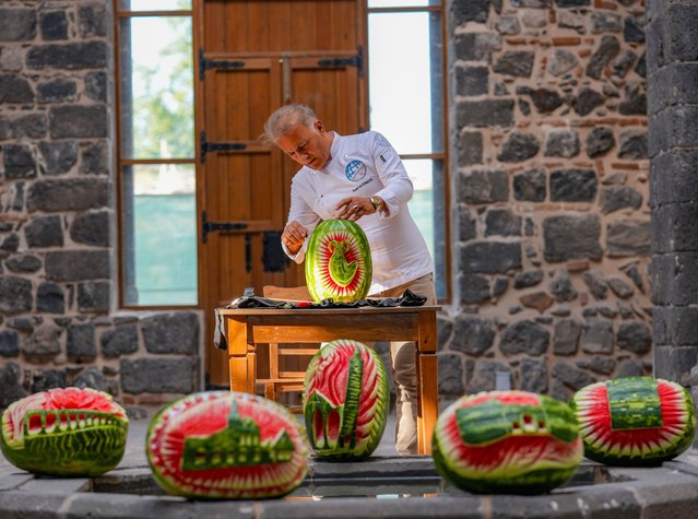 Chef Yusuf Altinkaya carves the city's historical sites onto registered Diyarbakir watermelons with his special knives and expert touches on September 18, 2025 in Diyarbakir, Turkiye. (Photo by Bestami Bodruk/Anadolu via Getty Images)