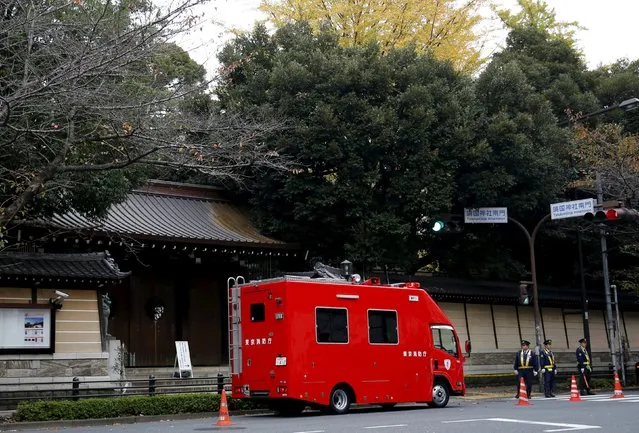 Police and a fire brigade vehicle stand outside the Yasukuni shrine after a blast inside its compound in Tokyo, Japan, November 23, 2015. (Photo by Toru Hanai/Reuters)