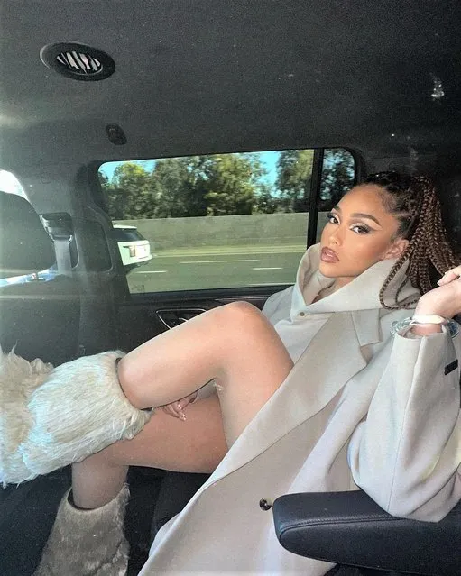 American socialite Jordyn Woods in the last decade of April 2023 show some leg in the back of the car. (Photo by jordynwoods/Instagram)