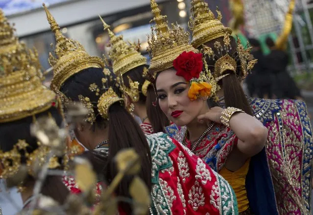 A Thai dancer performs during a parade held Wednesday, January 14, 2015 in Bangkok to promote tourism. The event was an effort by Thailand’s military-installed government to promote national pride and boost tourism. (Photo by Sakchai Lalit/AP Photo)