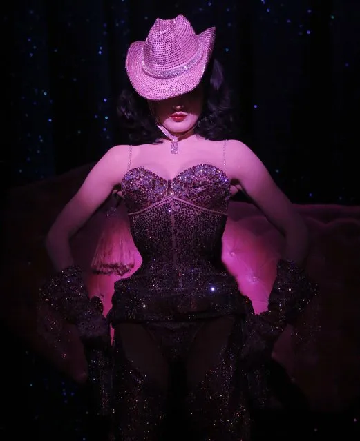 Dita Von Teese performs onstage at “Burlesque: Strip Strip Hooray!” Starring Dita Von Teese on Wednesday, June 19, 2013, in Los Angeles. (Photo by Todd Williamson/Invision/AP Photo)