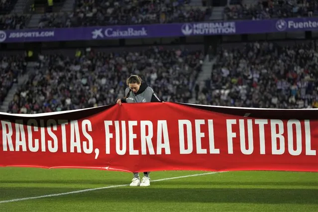 A banner reading in Spanish, “Racists, keep out of soccer” is displayed before the Spanish La Liga soccer match between Valladolid and FC Barcelona at the Jose Zorrilla stadium in Valladolid, Spain, Tuesday, May 23, 2023. (Photo by Manu Fernandez/AP Photo)