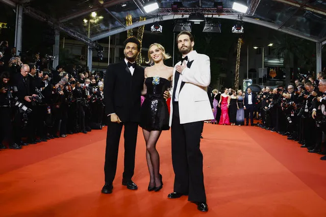 (From L) Canadian singer Abel Makkonen Tesfaye aka The Weeknd, French-US actress Lily-Rose Depp and US director Sam Levinson arrive for the screening of the film “The Idol” during the 76th edition of the Cannes Film Festival in Cannes, southern France, on May 22, 2023. (Photo by Eric Gaillard/Reuters)