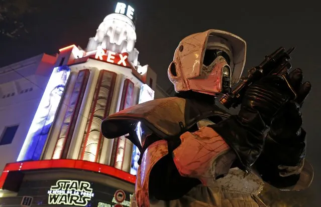 A man dressed as a Storm Trooper poses in front of the Grand Rex cinema before the screening of “Star Wars: The Force Awakens” in Paris, France, December 16, 2015. (Photo by Christian Hartmann/Reuters)