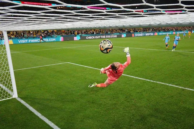 Mary Earps of England dives in vain as Sam Kerr (not pictured) of Australia scores her team's first goal during the FIFA Women's World Cup Australia & New Zealand 2023 Semi Final match between Australia and England at Stadium Australia on August 16, 2023 in Sydney, Australia. (Photo by Cameron Spencer/Getty Images)