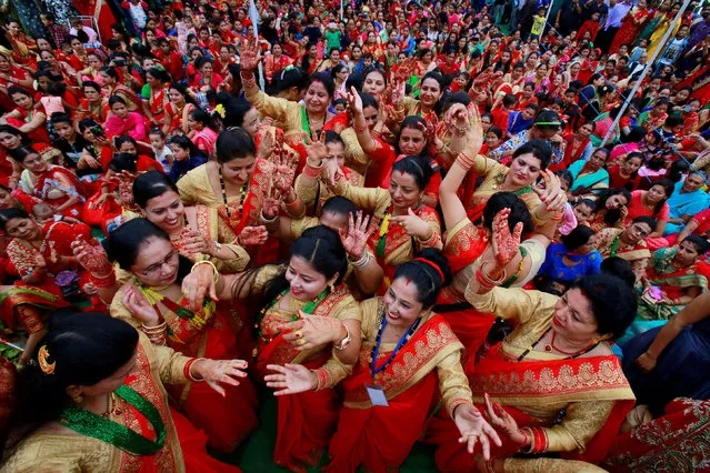 Nepali Hindu women dance during celebrations for the Teej festival in Chandigarh, India, September 12, 2018. (Photo by Ajay Verma/Reuters)