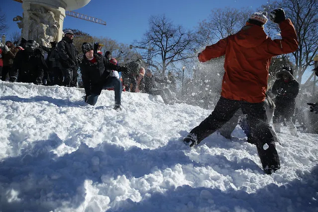 People participate in a snowball fight at Dupont Circle January 24, 2016 in Washington, DC. (Photo by Alex Wong/Getty Images)