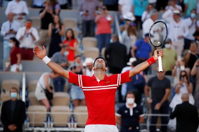 Serbia's Novak Djokovic celebrates winning the French Open men's final against Greece's Stefanos Tsitsipas in Paris, France, June 13, 2021. (Photo by Gonzalo Fuentes/Reuters)