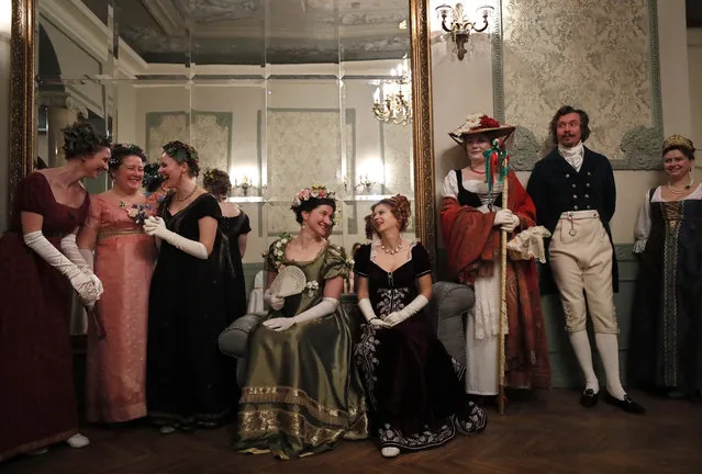 Participants wearing historical costumes of the 19th century attend a reconstruction of the Christmas Masquerade Ball in manors of the Stroganovs in Moscow, Russia, 12 January 2019. The tradition of the Christmas Masquerade Ball was started by Peter the Great. The event is organized the historical society “19th Production”. (Photo by Yuri Kochetkov/EPA/EFE)