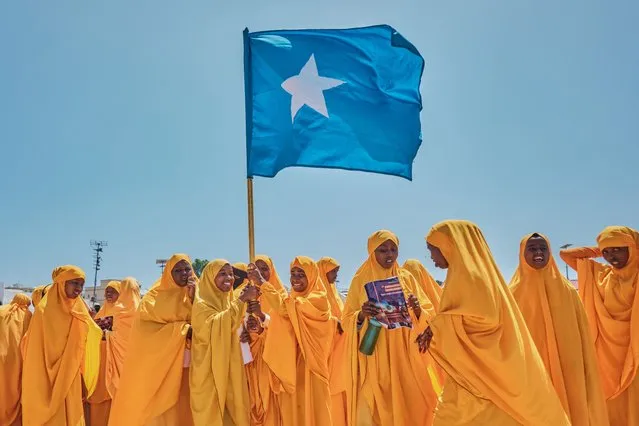 Students wave a Somali flag during a demonstration in support of Somalia's government following the port deal signed between Ethiopia and the breakaway region of Somaliland at Eng Yariisow Stadium in Mogadishu on January 3, 2024. Somalia vowed to defend its territory after a controversial Red Sea access deal between Ethiopia and the breakaway state of Somaliland that it branded as “aggression”. (Photo by Abdishukri Haybe/AFP Photo)