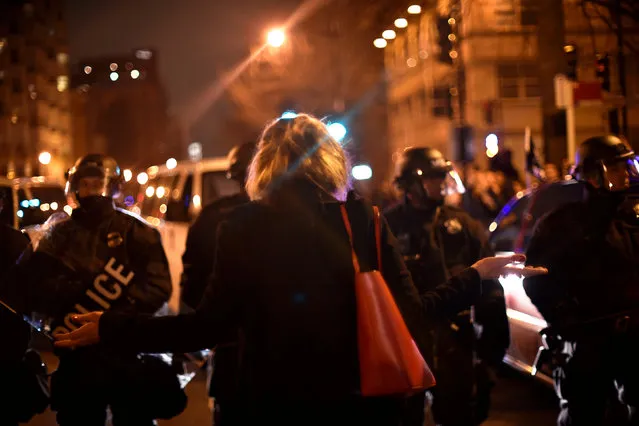 A young woman argues with riot police as they block her from reaching an inaugural ball that protesters against U.S. President Donald Trump are attempting to disrupt after Trump's inauguration in Washington, U.S., January 20, 2017. (Photo by James Lawler Duggan/Reuters)