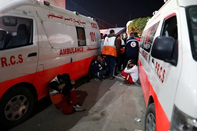 Palestinian medics react after several members of the Palestinian Red Crescent were killed when an Israeli strike hit an ambulance, according to the Red Crescent, in Deir al-Balah, in the central Gaza Strip on January 10, 2024. (Photo by Mohammed Al-Masri/Reuters)