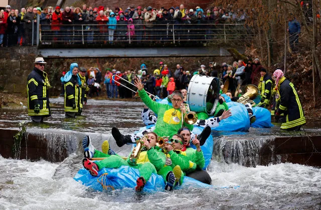 Carnival revellers with their self-made floats ride down the Schiltach stream during the “Bach na fahre” (race down the stream) raft contest in Schramberg, Germany, March 4, 2019. (Photo by Kai Pfaffenbach/Reuters)